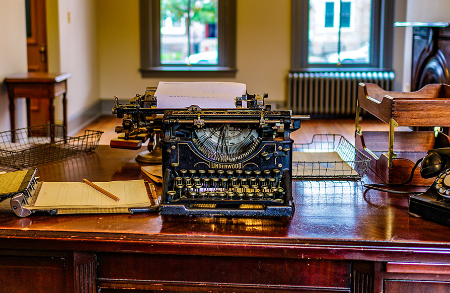 A close up image of a historic typewriter on the desk of Carter G. Woodson